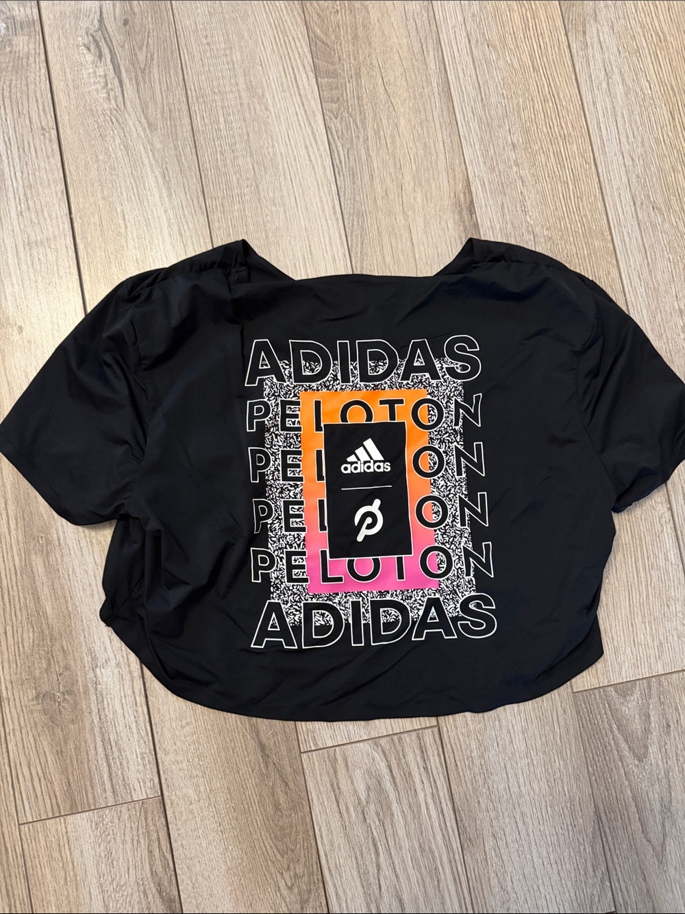 adidas Black Graphic Crop Tee with Orange-Pink Accent